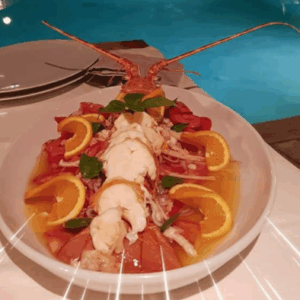 Aragosta alla catalana con basilico e fette  d’arancia. Tomaso Fruianu la serve così